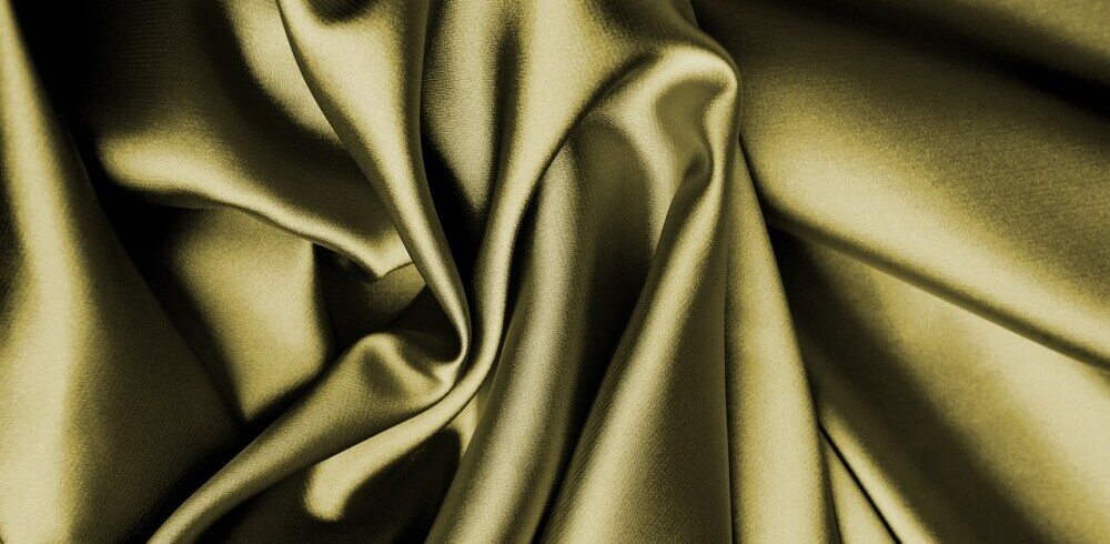 draped khaki green silk fabric on it's own